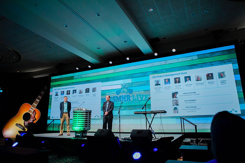 Far shot of Product Update speakers on stage
